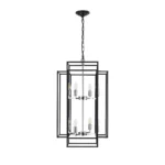 Goldoma geometric chandelier suspended above a wooden dining table, with adjustable cords visible, in a bright room