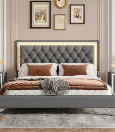 Queen bed frame with charging ports featuring an adjustable velvet wingback headboard in a modern bedroom