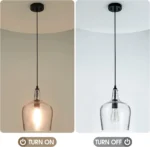 Side view of the 9-inch seeded glass pendant, highlighting the sleek black fitting and glass texture.