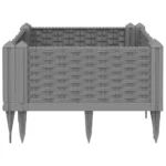 Large garden planter in light grey polypropylene with green plants on patio