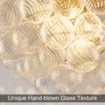 Elegant glass globe chandelier with brass accents in a modern living room