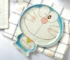 Japanese ceramic dinnerware set with hand-drawn cat design on blue rectangular plate and bowl