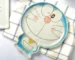 Japanese ceramic dinnerware set with hand-drawn cat design on blue rectangular plate and bowl