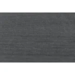 Elsa modern nightstand in black and grey with two drawers placed beside a bed in a contemporary bedroom