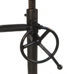 Goldoma 48 inch solid wood and iron trestle dining table with brown top and black base in a dining room setting