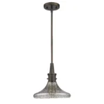 Hanging light illuminated with warm glow, highlighting the pebbled glass pattern in a dim room.