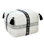 Goldoma 18-inch black striped pouf ottoman as a stylish foot rest and extra seating in a modern living room