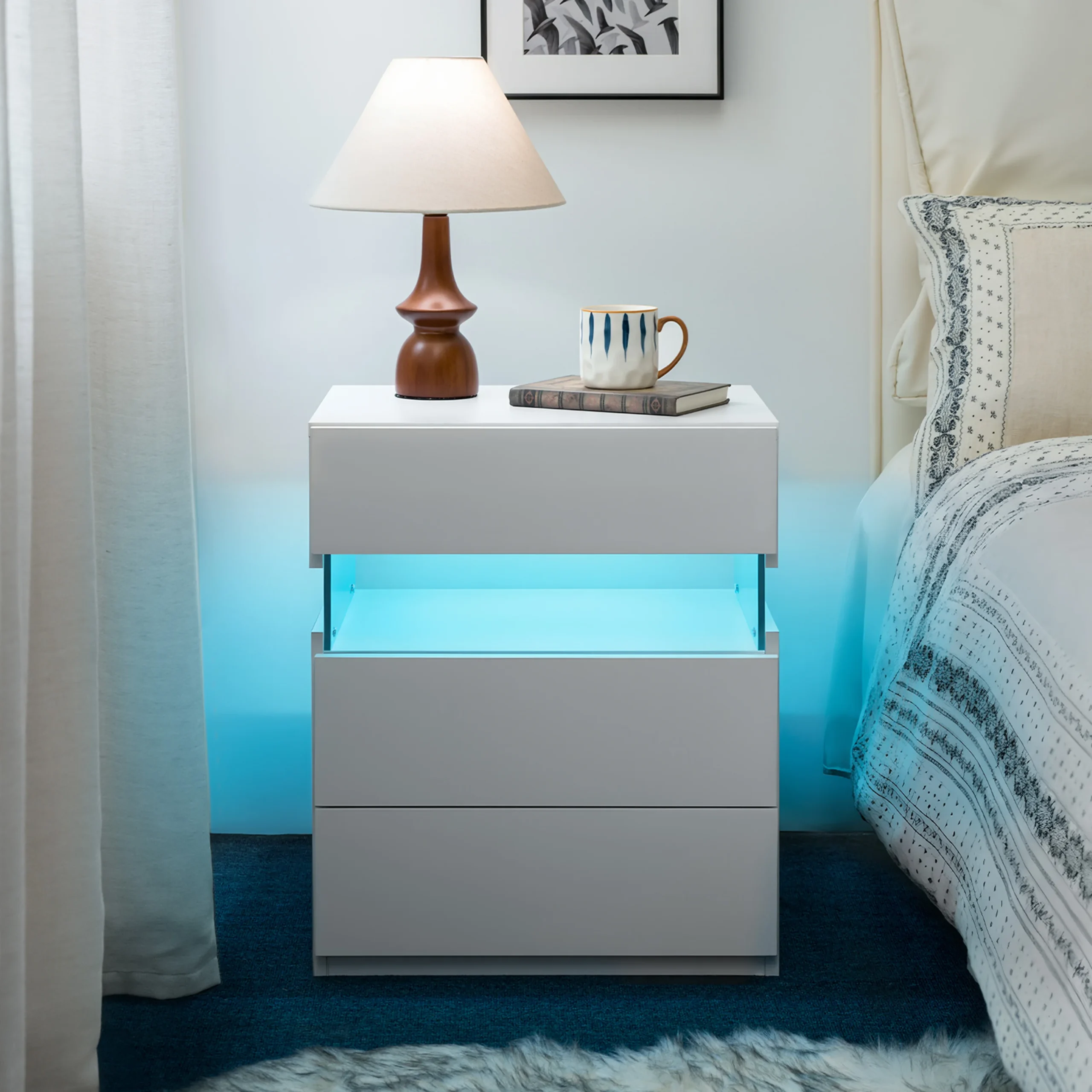 White 3 drawer nightstand with LED lighting in a modern bedroom