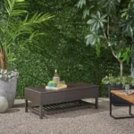 Goldoma Regent storage bench with metal rack featuring woven rattan top and black metal frame in entryway