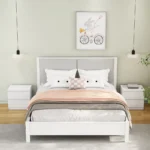 White nightstand with 2 drawers and handle-free design featuring a thickened top plate in a modern bedroom setting
