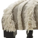 Goldoma 47-inch cream boho stripe upholstered bench with black metal legs in a living room setting