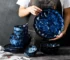 Blue ceramic dinner plates set on a wooden table