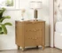 Mid century nightstand with fluted front and gold handles in a bedroom setting