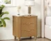 Mid century nightstand with fluted front and gold handles in a bedroom setting