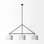 Close-up of the three-bulb hanging light showing white fabric shade and brushed metal frame, warm glow.