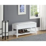White storage bench with padded seat and shoe shelf in entryway