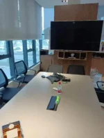 Modern 6-seater dining table with black MDF frame, gold legs, and tempered glass top in a contemporary dining room setting