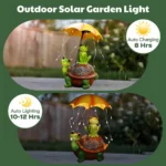 Side view of frog riding turtle statue, solar umbrella, resin material, surrounded by flowers and stones in garden.
