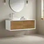 Modern 48-inch wall-mounted single sink bathroom vanity in white with a sleek countertop and chrome faucet, set against
