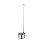 Stainless steel measuring cup with hook hanging on a kitchen rack