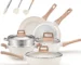 Goldoma non toxic cookware set with 12 pieces pots and pans on a kitchen counter