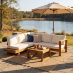 Modern outdoor sofa set with acacia wood frame and beige cushions on patio