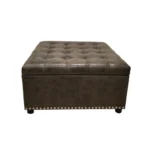 Goldoma modern black square storage ottoman with button tufting and wooden legs in a living room setting