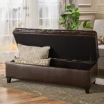 Purple fabric storage ottoman with hidden compartment and birch wood legs in a living room