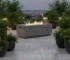 Goldoma 50k BTU fire pit with natural gas flames on a patio