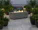 Goldoma 50k BTU fire pit with natural gas flames on a patio