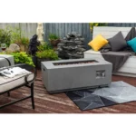 Goldoma 50k BTU fire pit with natural gas flames on a patio