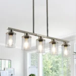 37-inch brushed nickel 5-light chandelier with clear glass shades, shown in a modern kitchen setting.