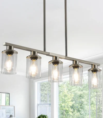 37-inch brushed nickel 5-light chandelier with clear glass shades, shown in a modern kitchen setting.