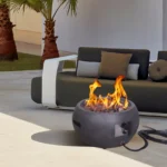 Propane fire pit table with corten steel base and concrete top on a patio