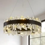 Modern crystal chandelier hanging over a dining table in a contemporary living room