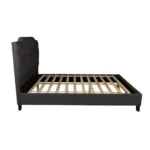 Modern faux leather queen bed with tufted upholstered headboard in a stylish bedroom setting