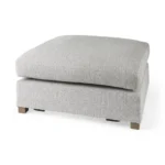 Goldoma light gray fabric cocktail ottoman with brown wood frame in living room