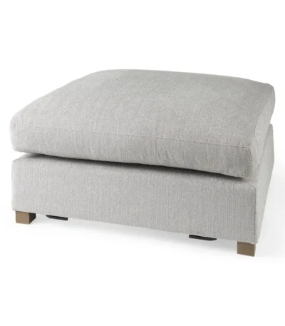 Goldoma light gray fabric cocktail ottoman with brown wood frame in living room