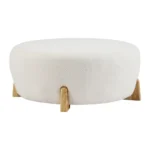 Goldoma white fabric footrest stool with splayed rubber wood legs in a living room near a sofa