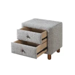 Cleo Gray Boucle Nightstand with two drawers and wooden legs in a modern living room setting