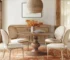Walnut modern solid wood round pedestal dining table in a cozy dining room setting