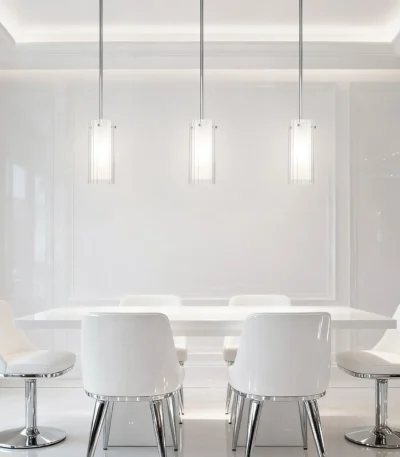 Modern Nordic glass pendant light in black metal, hanging over a wooden dining table.