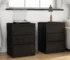 Black 3 drawer nightstand set of 2 with handle-free design and thickened top plate in a modern bedroom