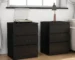 Black 3 drawer nightstand set of 2 with handle-free design and thickened top plate in a modern bedroom
