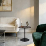 Set of two small round side tables with concentric circle walnut wood tops and black metal pedestal bases, modern design for living room or bedroom