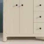 Open drawers of the 36-inch vanity revealing interior space, with towels and toiletries neatly arranged.