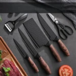Goldoma chef knife set with wooden handles on cutting board