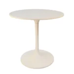 White rounded marble pedestal base dining table with iron base in a modern dining room