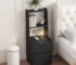 Modern nightstand with charging station featuring USB ports and a bookshelf in a bedroom setting