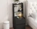 Modern nightstand with charging station featuring USB ports and a bookshelf in a bedroom setting